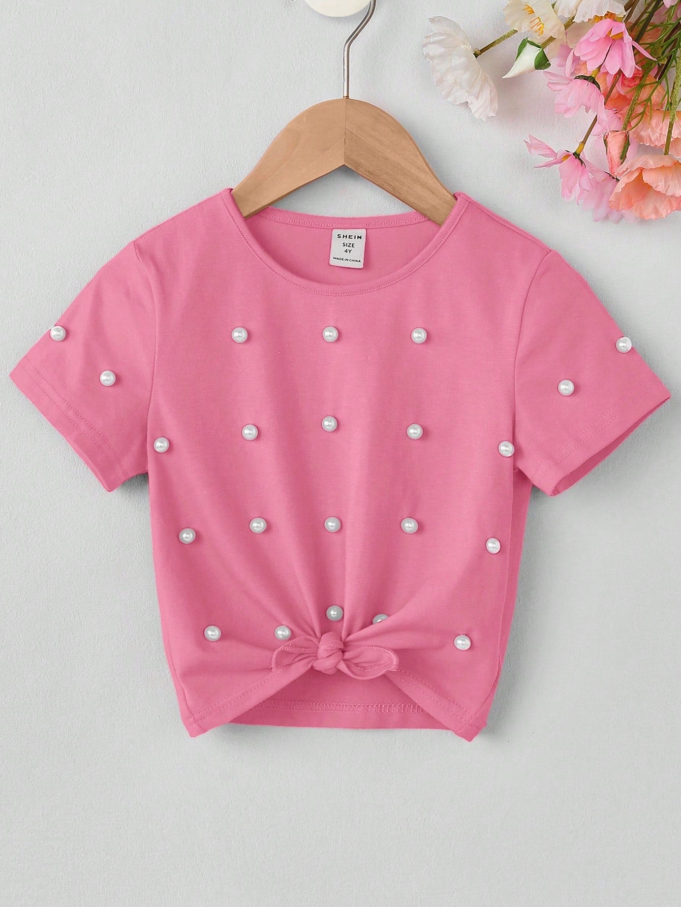 Knitted Pink T-shirt for Toddler Girls, Adorned with Pearl-Studded Hem and Bow Tie Detail